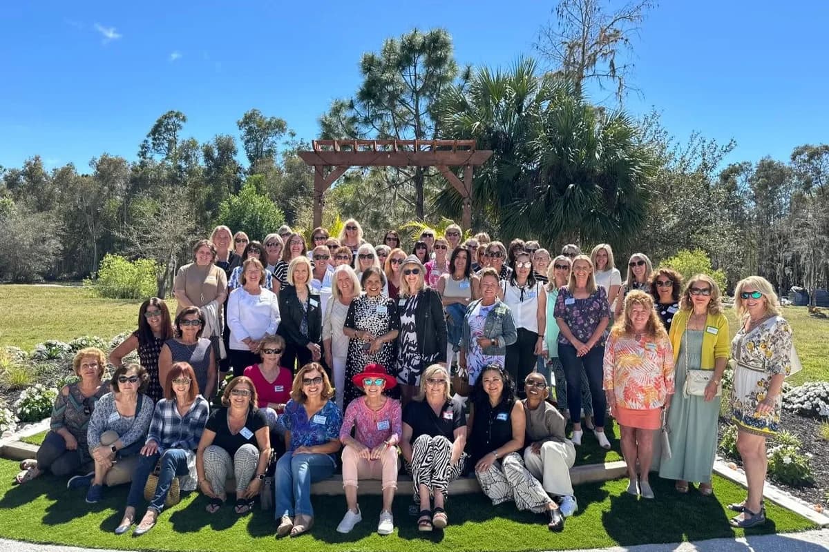 A large WildBlue ladies luncheon group gathered outdoors