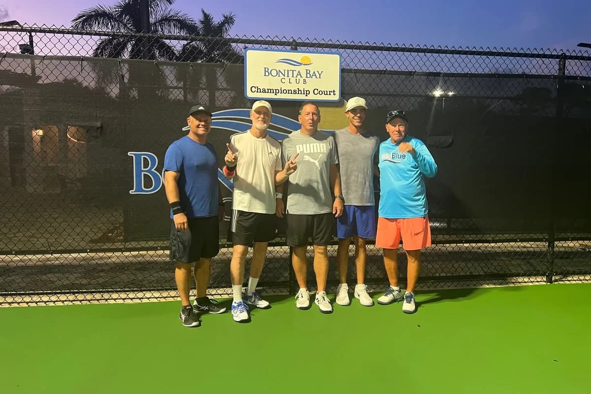 Five members of the WildBlue Steel pickleball team on a championship court